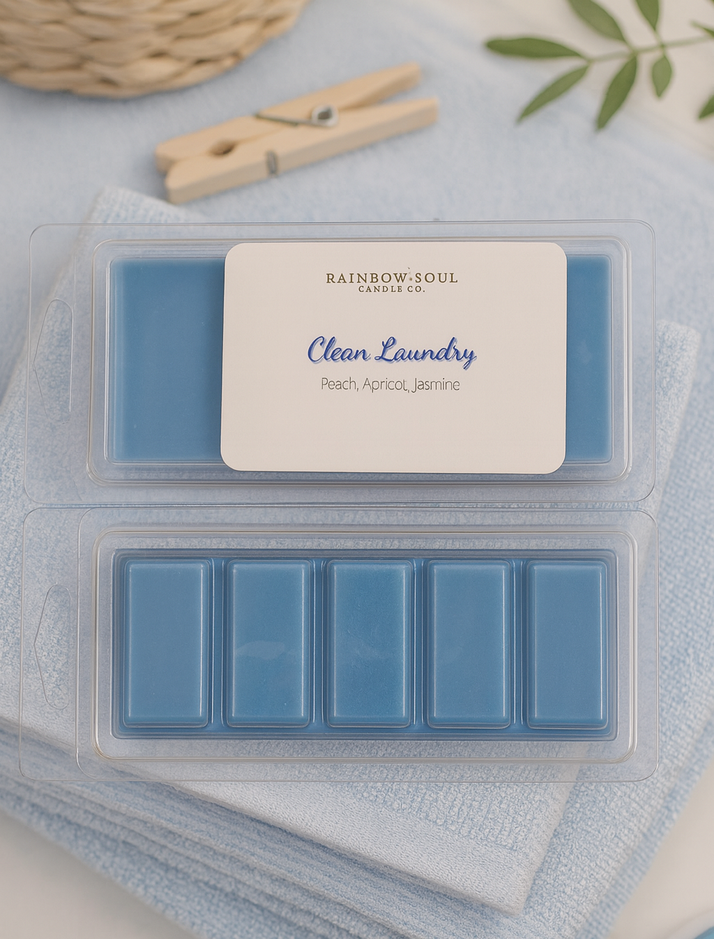 Blue snap bar wax melts in a mold with a label on a light blue surface.