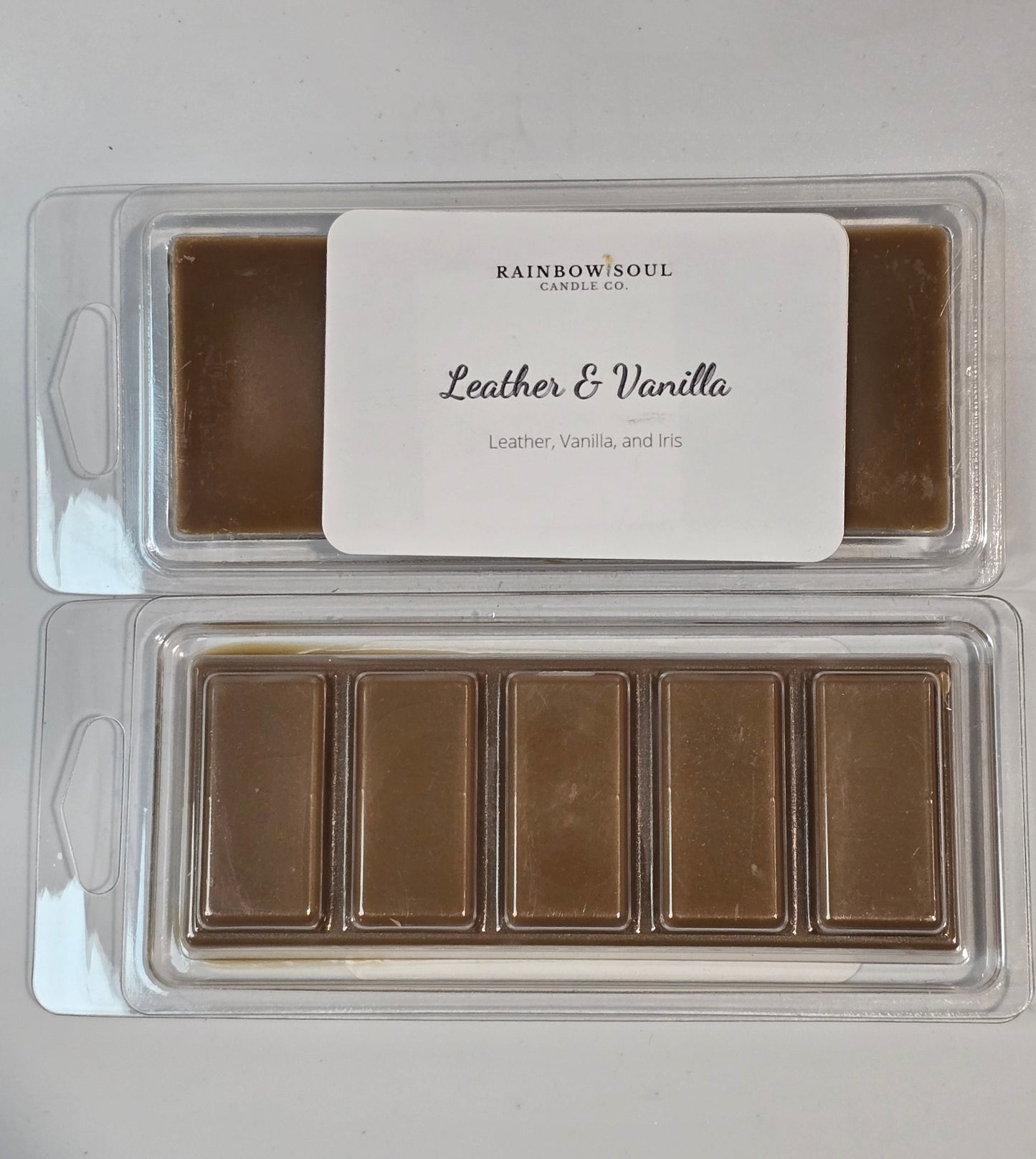 Wax melts snap bars in a clear plastic packaging with a label on a light gray background