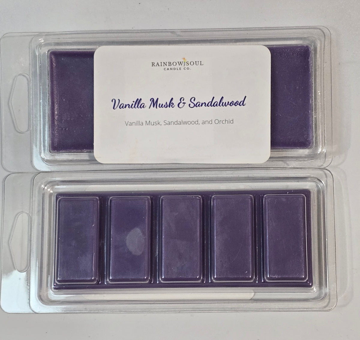 Purple wax melt snap bars  in a clear plastic container with a label on a white background